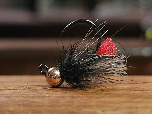 Cloaked red tag nymph